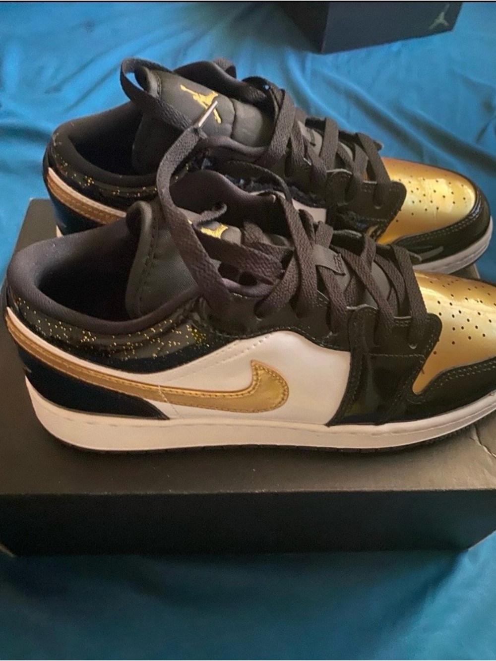Jordan 1 low Sneakers in Black, White, and Gold